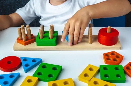 OT therapist working with child at home